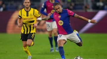 Barcelona toma susto, mas segura presso do Dortmund - Foto:  PAU BARRENA / AFP